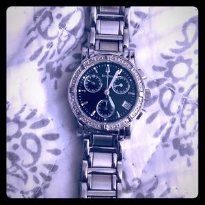 Bulova women’s watch , black face plate,